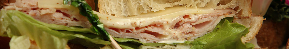 Eating Sandwich at Sam's Super Samwiches restaurant in Homewood, AL.